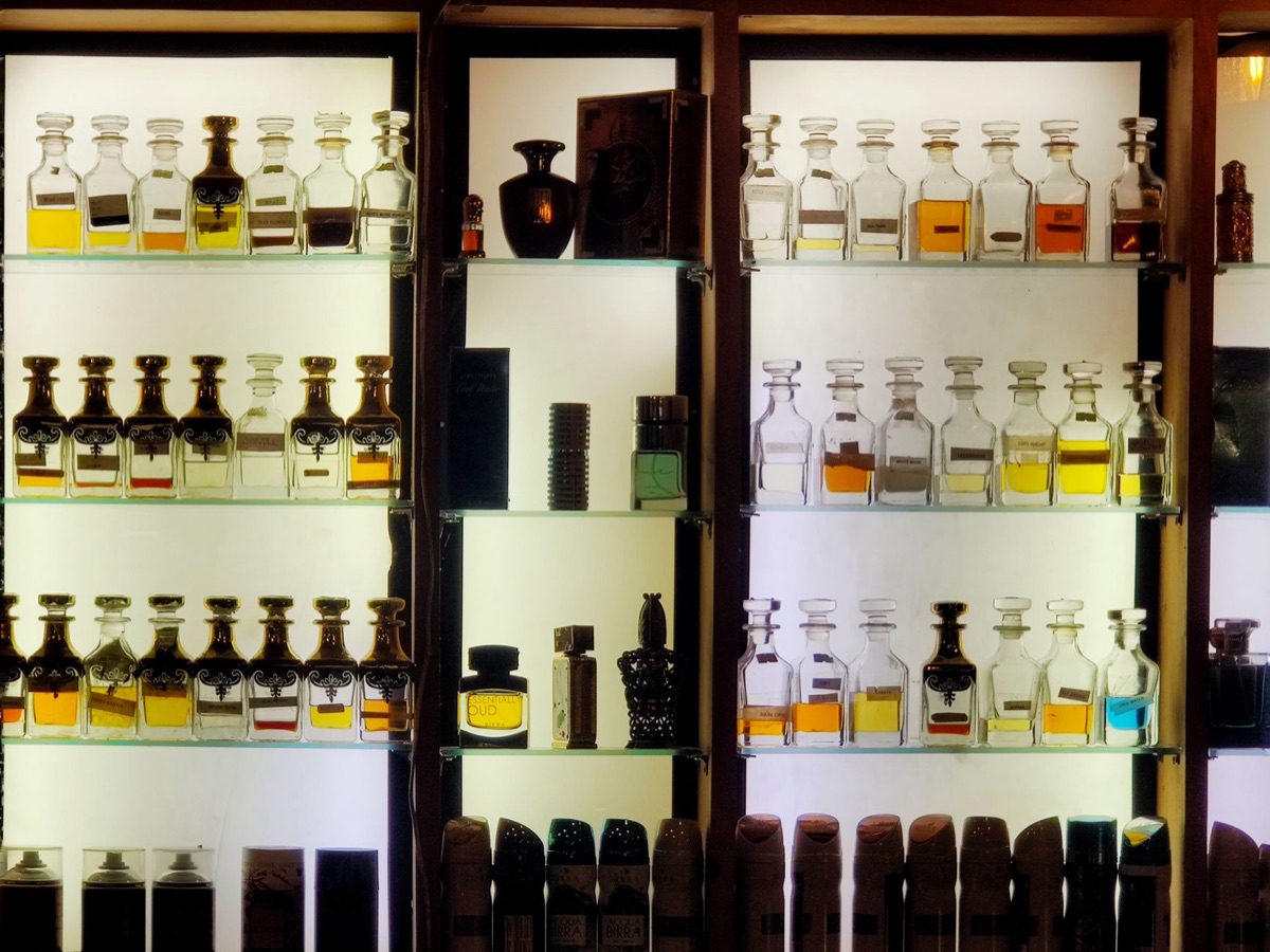 A collection of premium niche perfume bottles on a marble surface